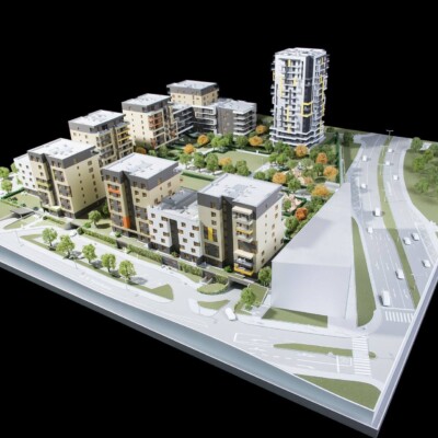 Maquette d'un projet immobilier moderne comprenant plusieurs bâtiments résidentiels et aménagements paysagers à Feuguerolles-Bully.
